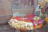 Varanasi - pilgrims purchasing flowers for puja 